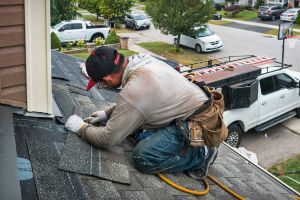 Professional Roofing technician working in Harlan, IA
